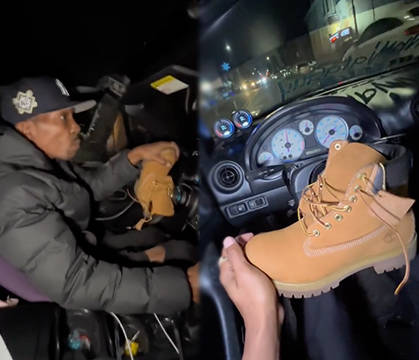 This Is As New York As It Gets: Dude Drives Car With Timberland Boot As His Steering Wheel!